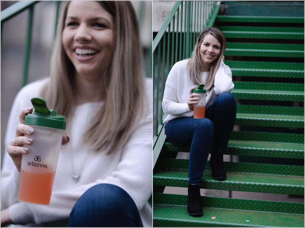 arbonne consultant poses on green staircase for personal branding photography