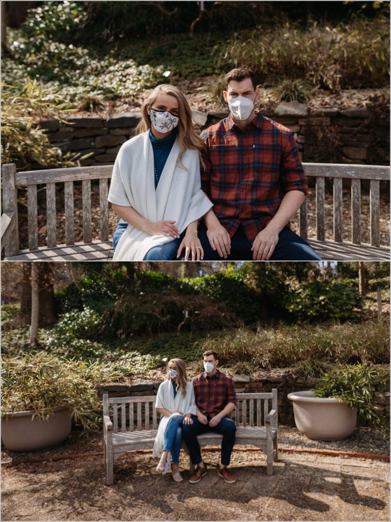 couple poses in masks on a bench in the asian garden at the national aboretum