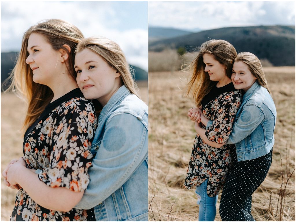 two women embrace on roan mountain in surprise proposal engagement photos