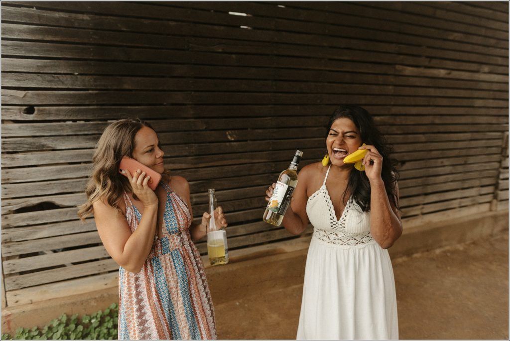 women in sundresses pose with wine and banana phone in best friends photoshoot at linganore winery