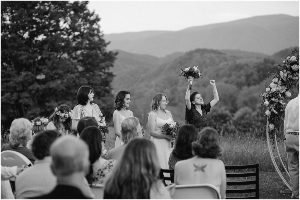 bridesmaids celebrate in bristol tn wedding in front of the mountains
