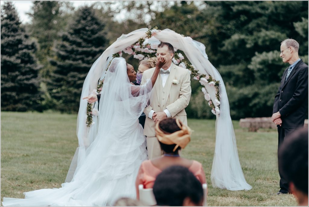 bride and groom during ceremony at kings contrivance restaurant