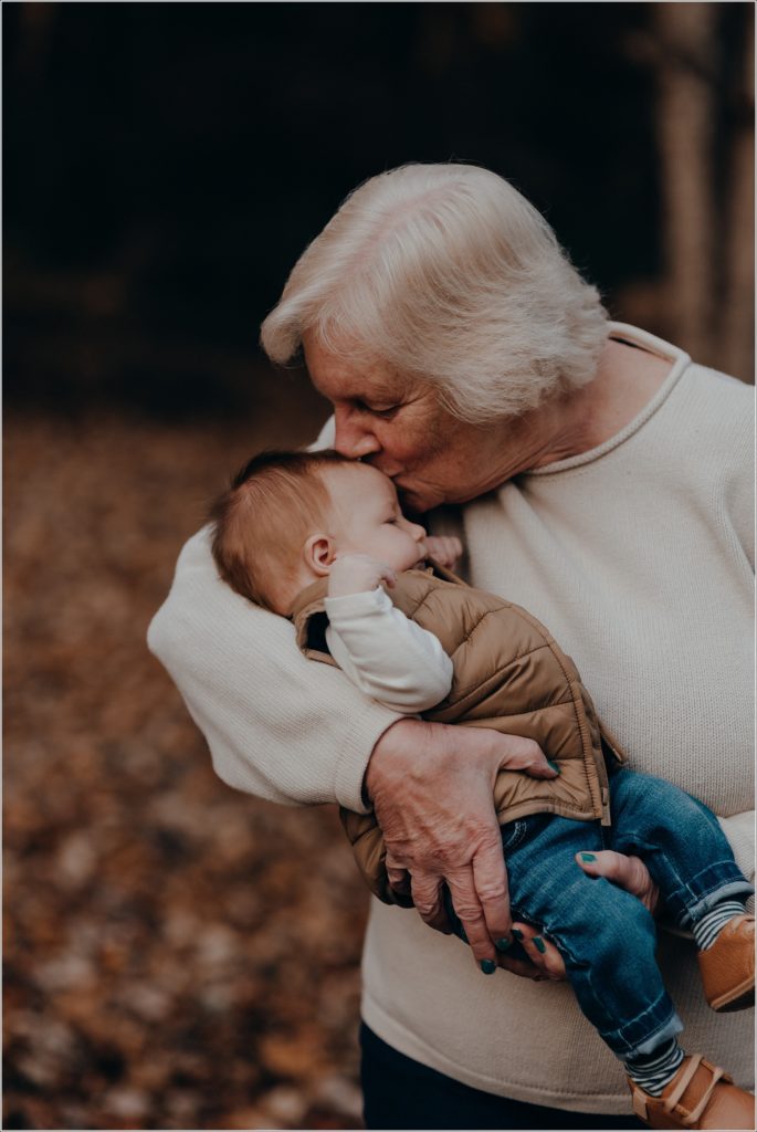 grandmother kisses grandson babies head at abingdon winery