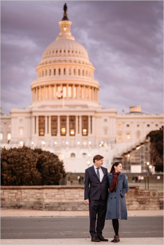 couple poses in front of the US Capitol for elopement