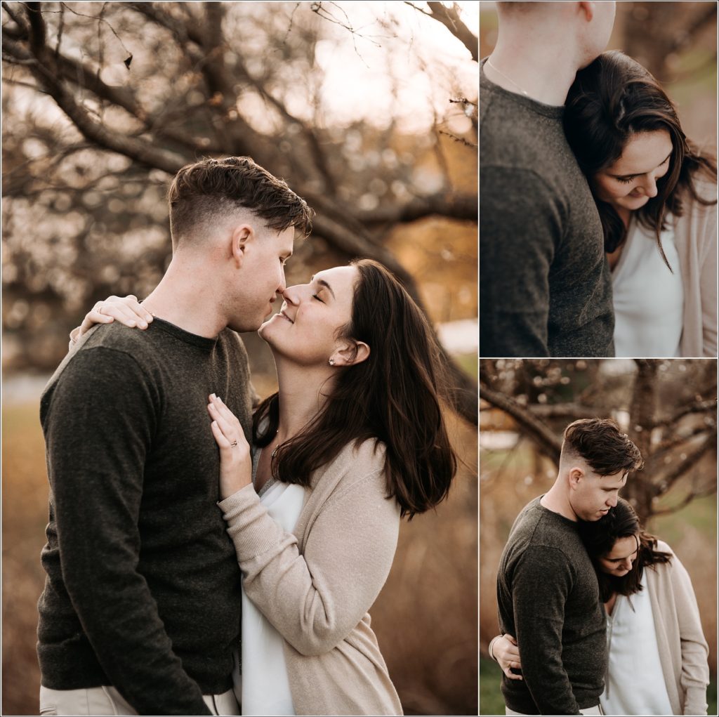 couple leans in to kiss each other in urbana maryland by a beautiful tree