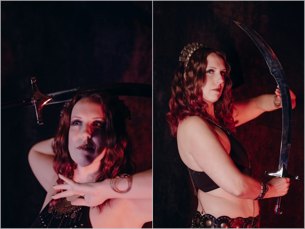belly dancer photoshoot in red lighting in frederick maryland with sword