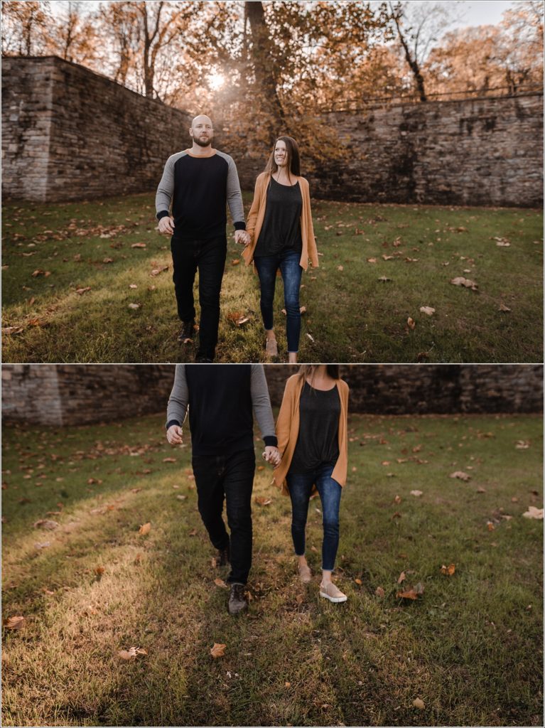 couple walks in the sunset holding hands for fall family photos in thurmont maryland at catoctin furnace
