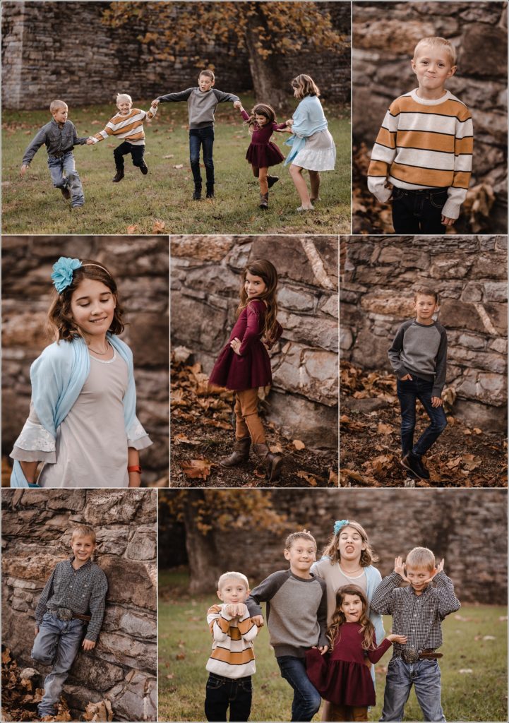 family poses for large family photos in the fall at catoctin furnace at sunset