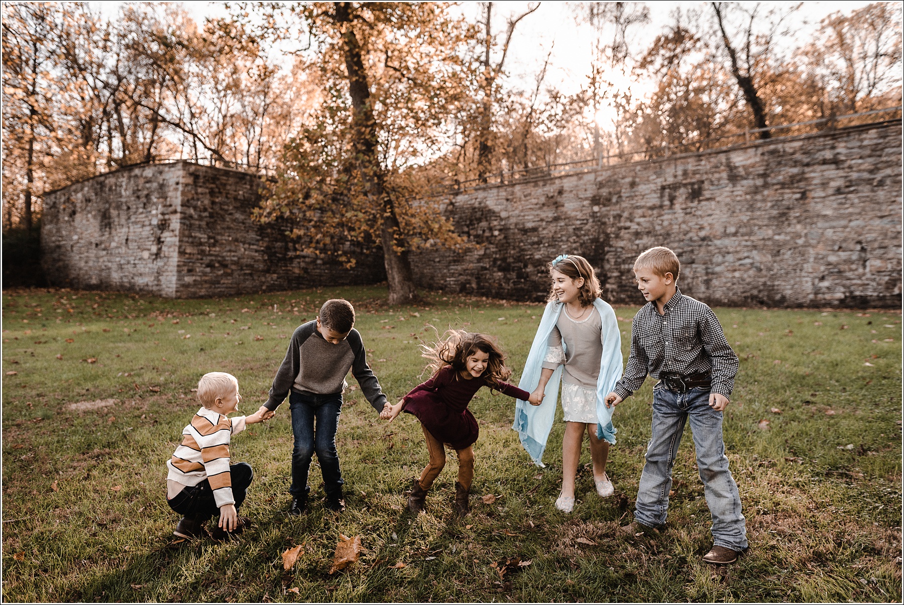 kids hold hands and jump together at catoctin furnace