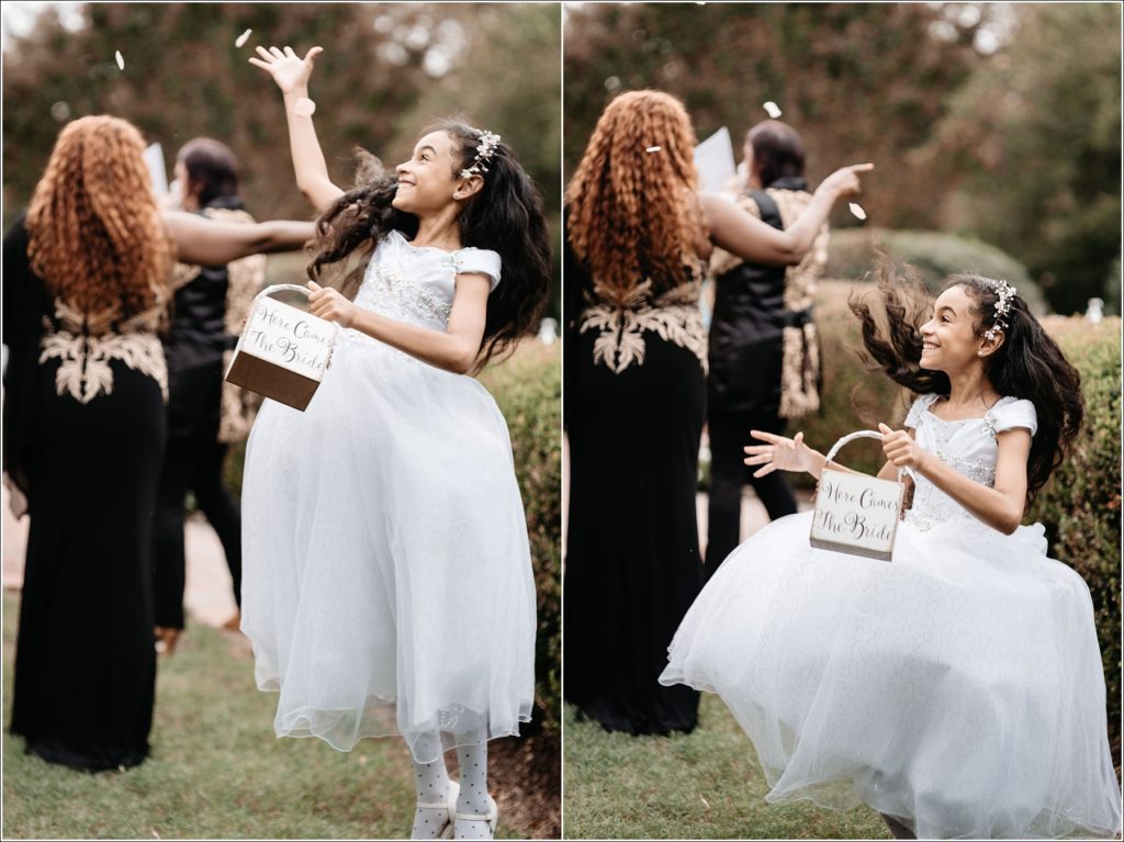 flower girl jumps and throws petals at kings contrivance wedding