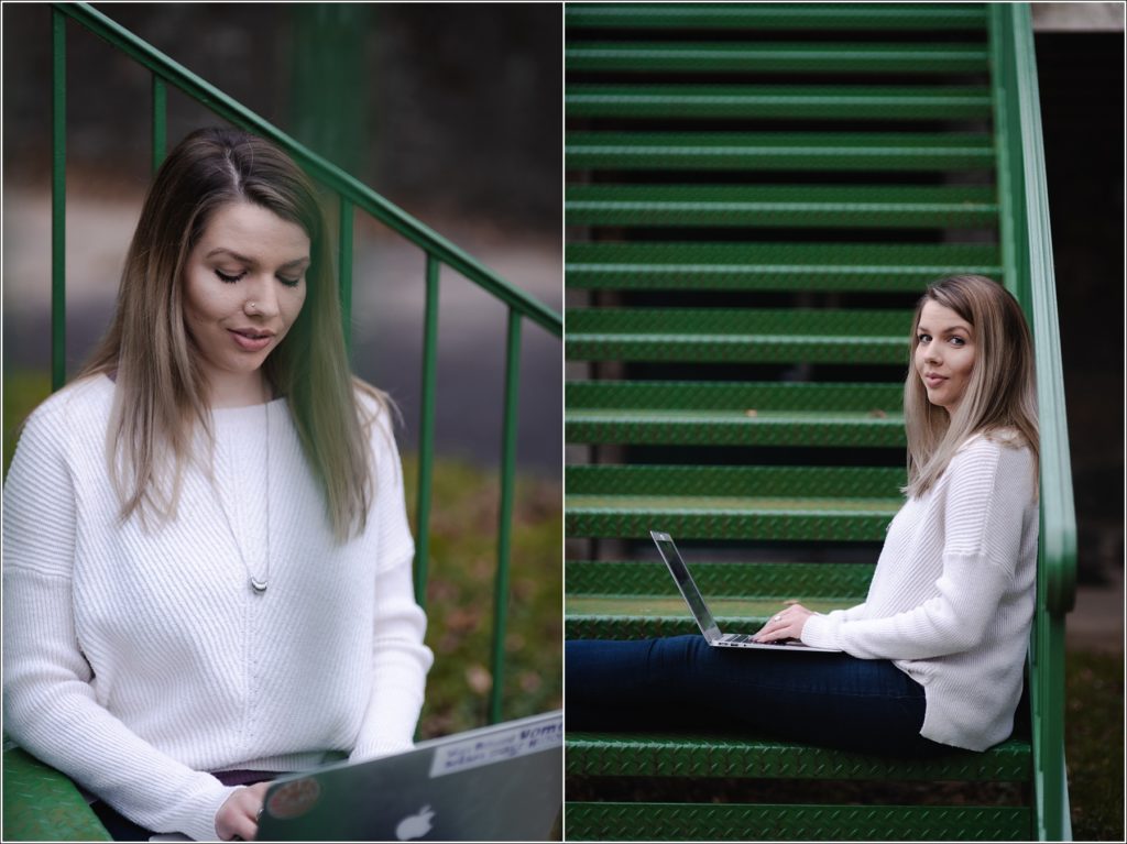 arbonne consultant poses with laptop on green staircase for personal branding photography