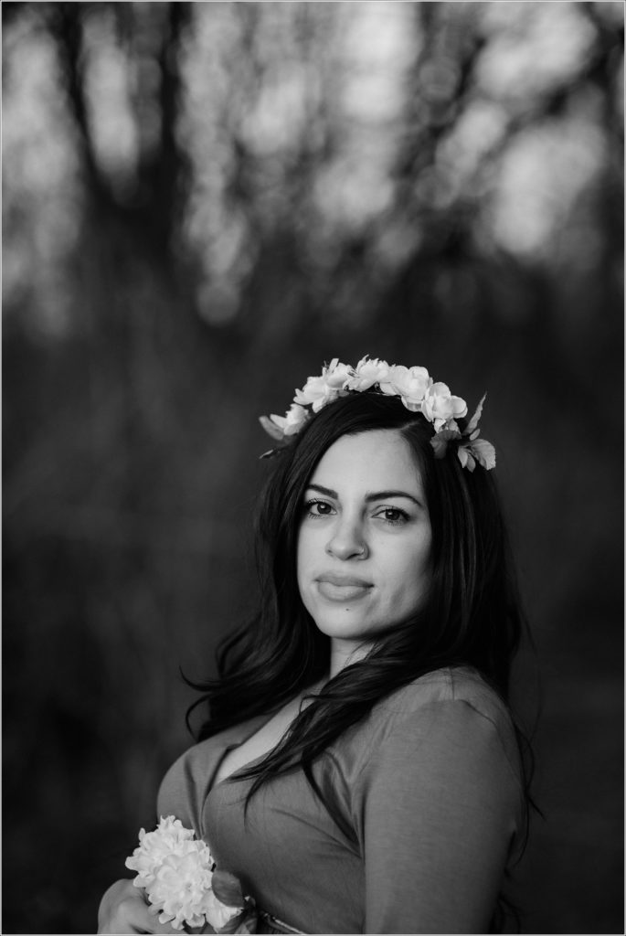 black and white photo of mama to be in flower crown