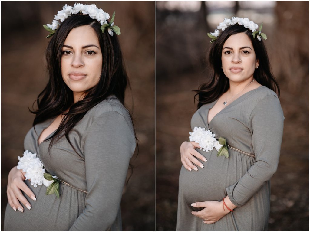 photo of mama to be in white flower crown and olive maternity dress holding her belly