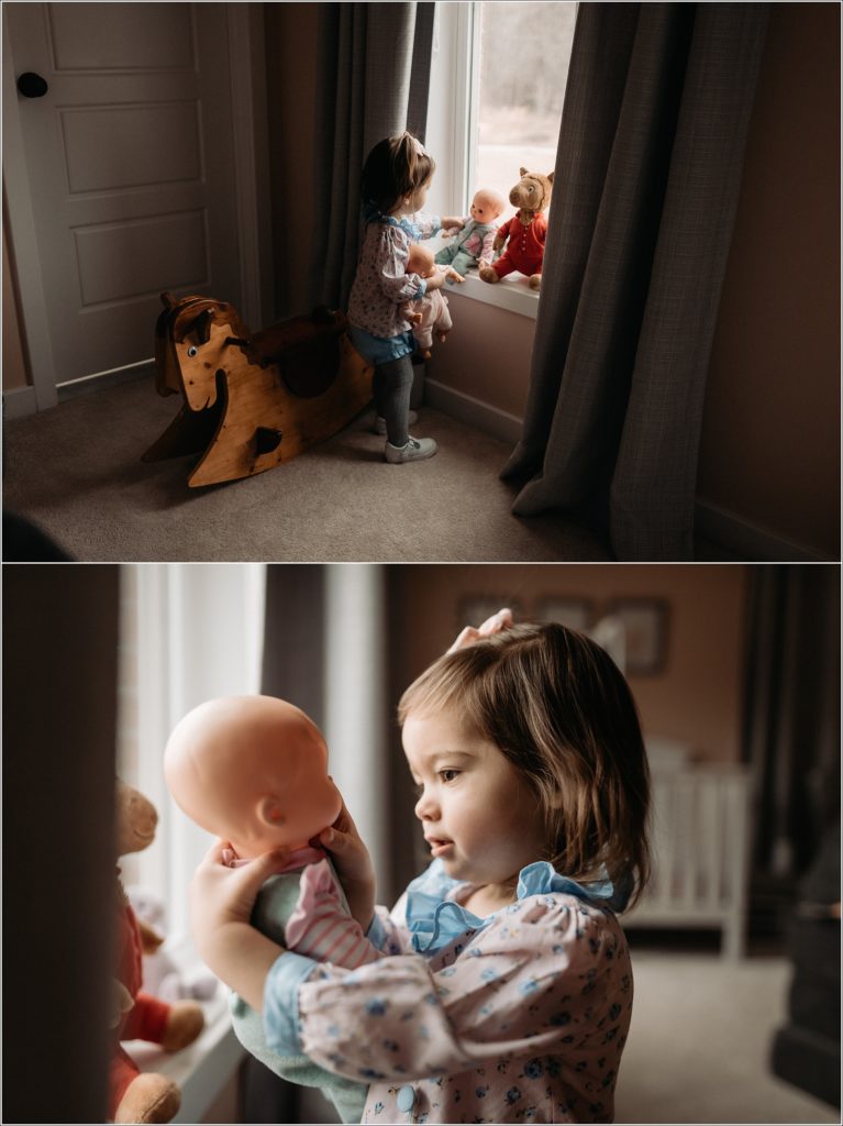 daughter playing with toys in window light for in home maternity photography