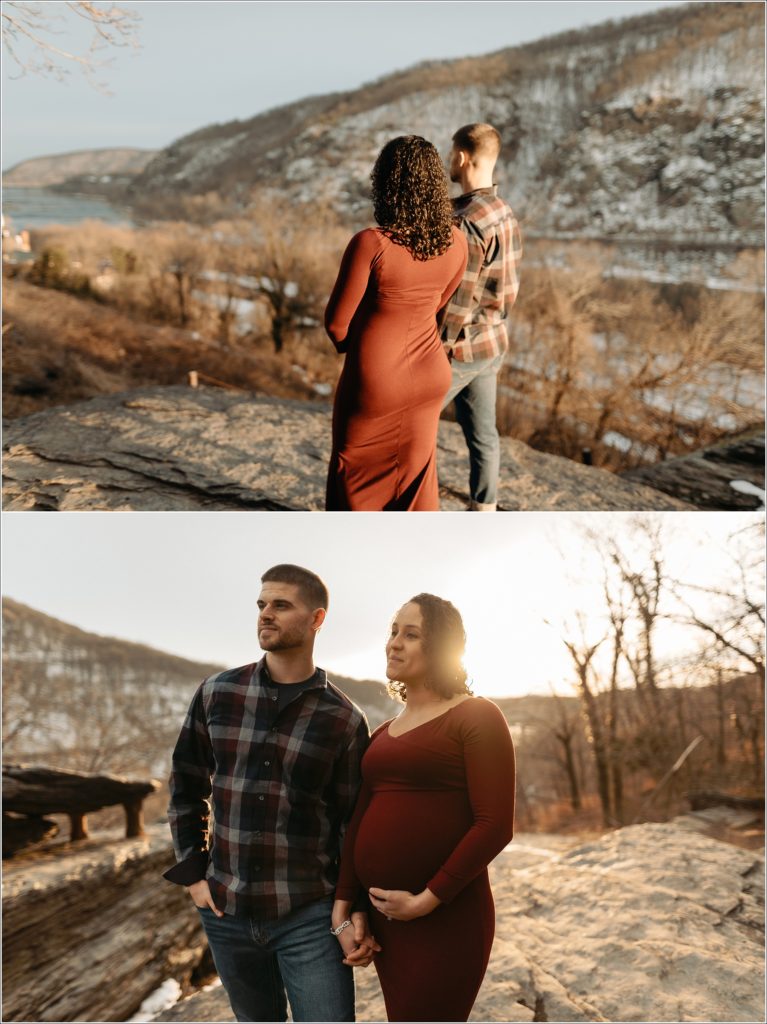 couple poses with pregnant belly in red maternity dress and flannel shirt at sunset in Harper's Ferry with Maryland maternity photographer