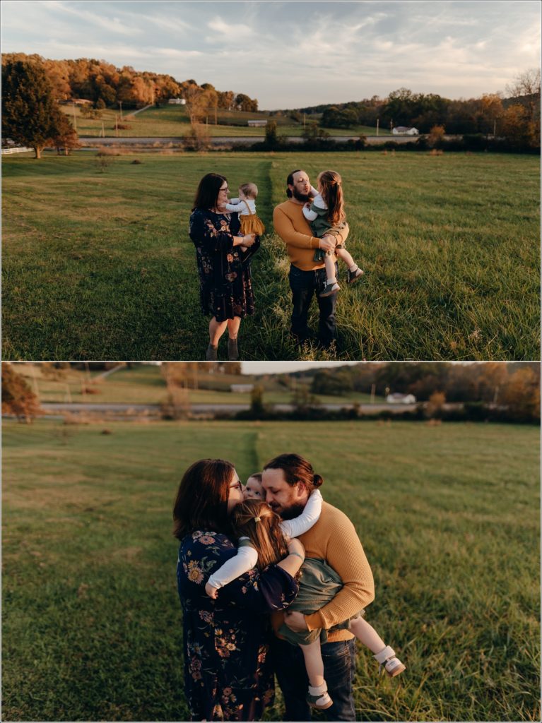 family of four hugs at sunset on green grass for swva photography