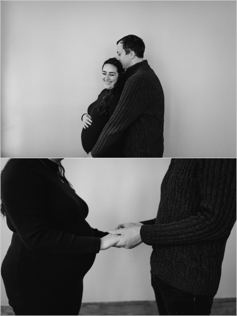 man and woman pose for maternity photos in downtown Frederick photo studio image in black and white