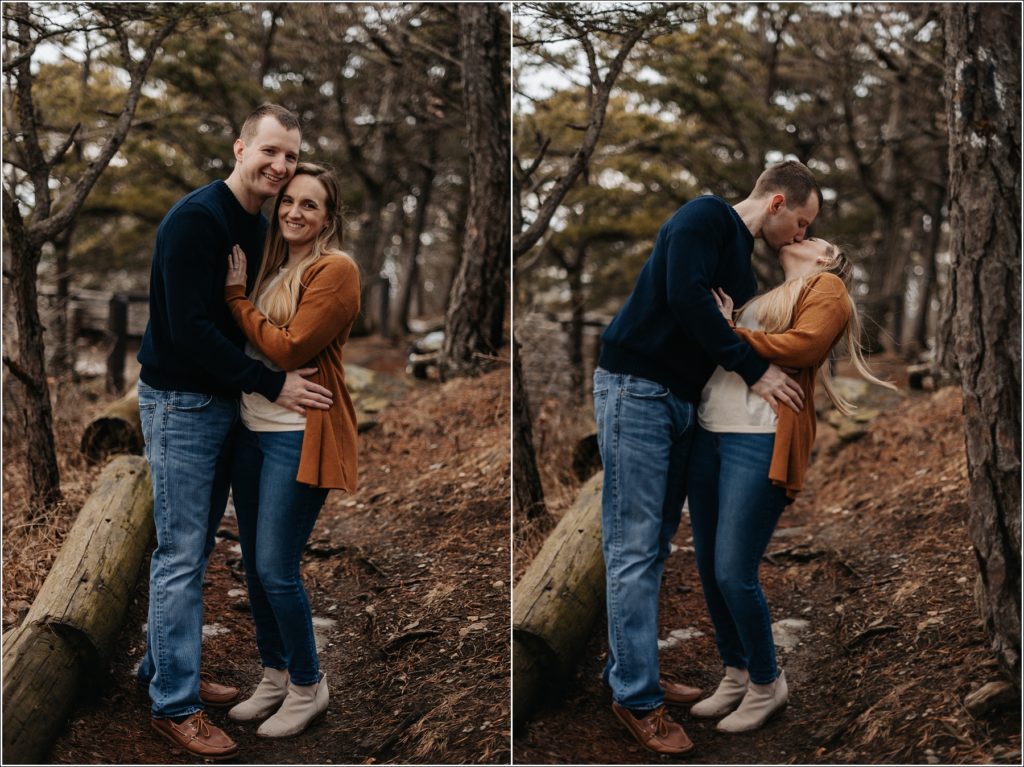 couple in blue and orange sweaters pose at the middletown overlook for firefighter engagement photos