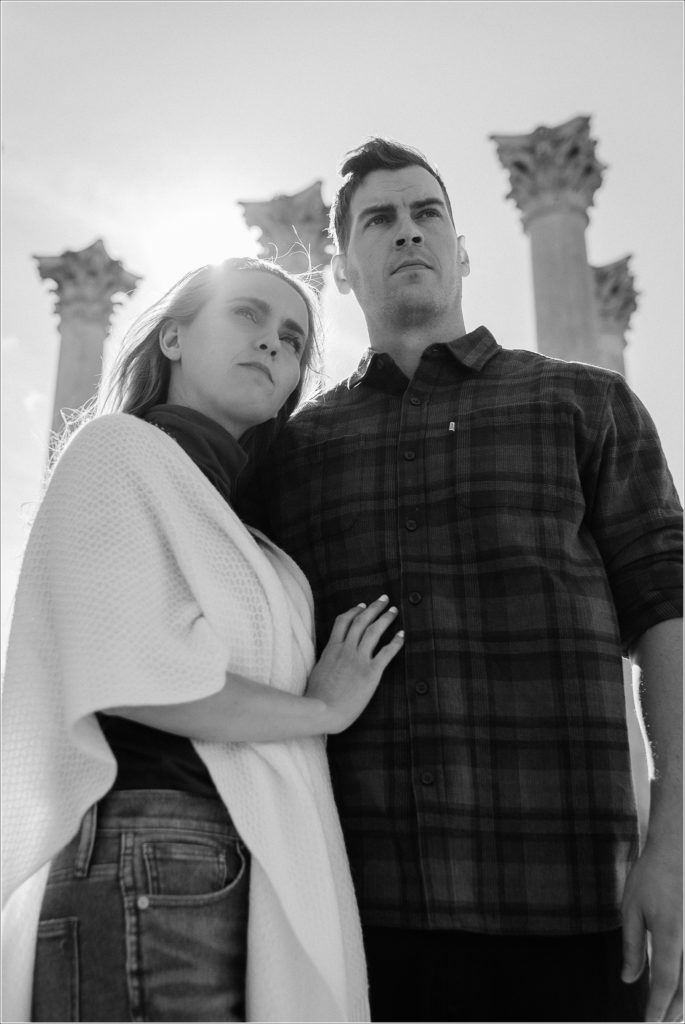 black and white image of couple embracing at the columns for national arboretum engagement photos