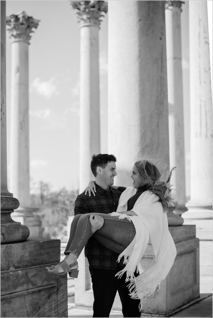 black and white image of couple embracing at the columns for national arboretum engagement photos