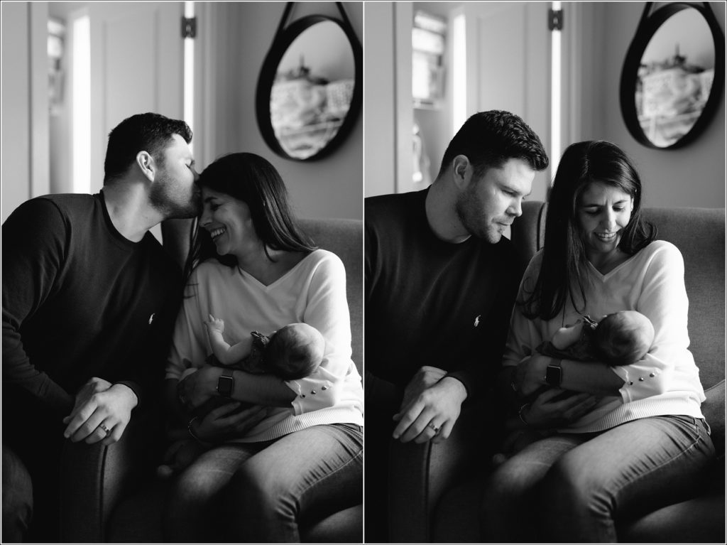 black and white images of man kissing womans head while she holds newborn baby