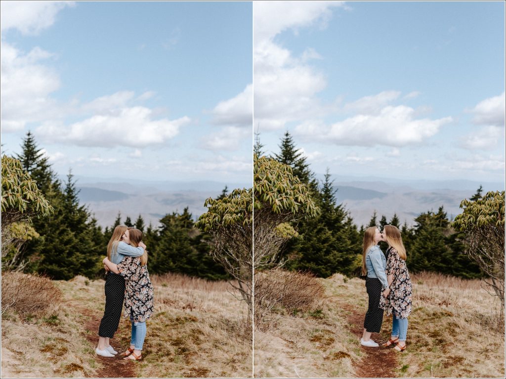 two women embrace and kiss for surprise proposal mountain engagement photos