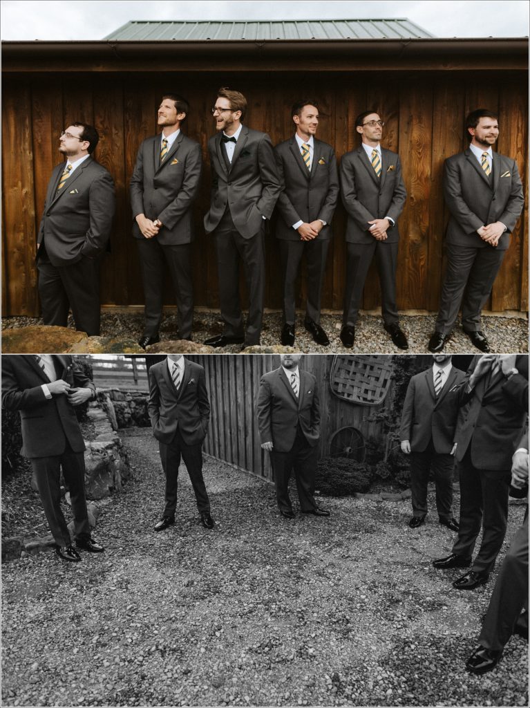 groomsmen stand against a wall in grey suits at the barns at chip ridge