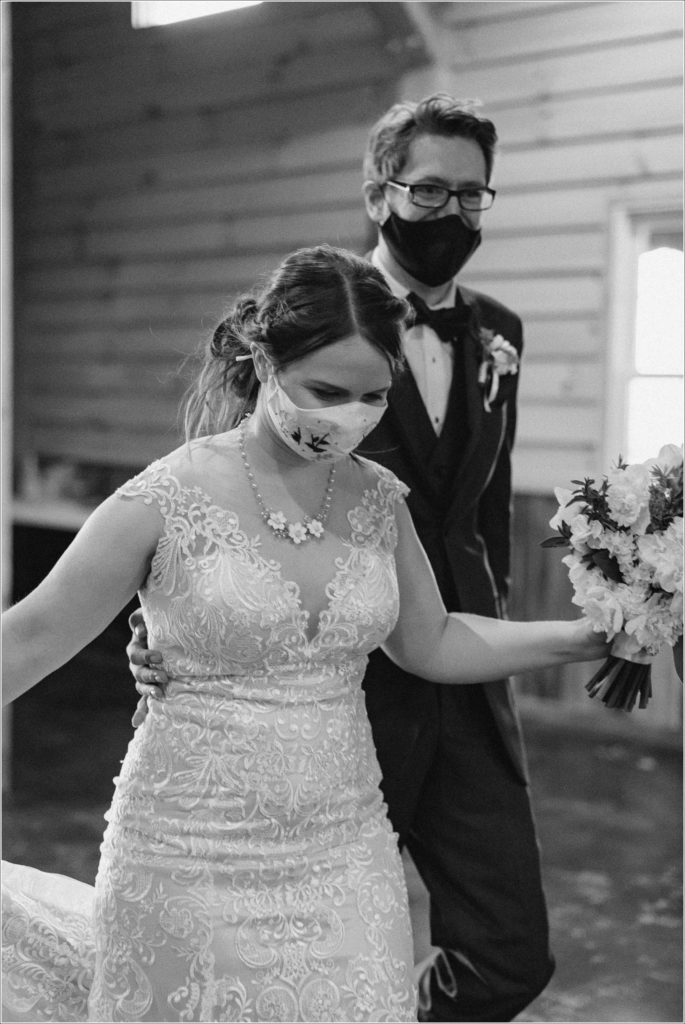 bride and groom enter in black and white image at the barns at chip ridge