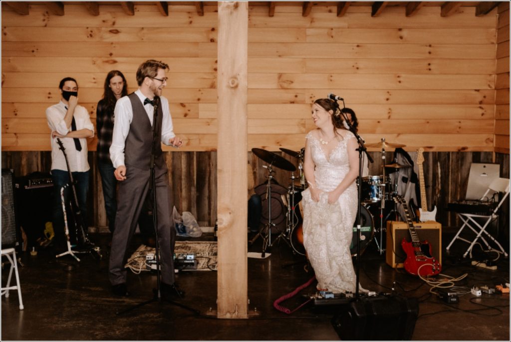 bride and groom sing to one another at reception at the barns at chip ridge