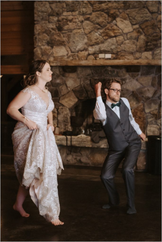 bride and groom dance together at the barns at chip ridge