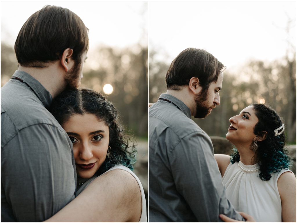 couple snuggles up in white dress and pearls and grey shirt at sunset for dc photoshoot