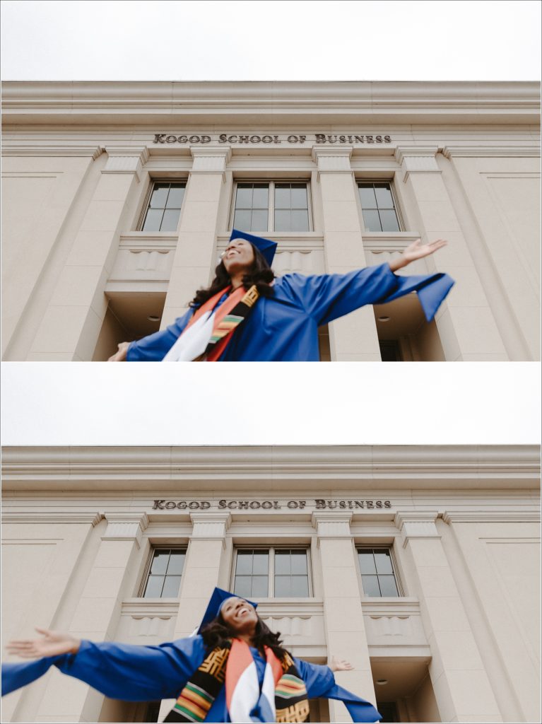 american university grad in blue cap and gown spins around in graduation photos