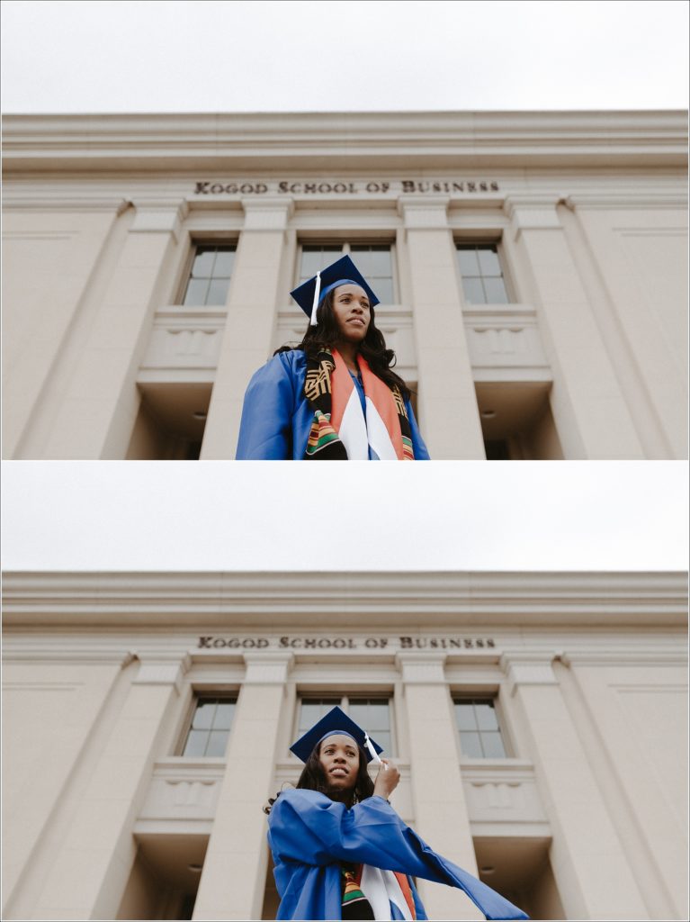 american university grad in blue cap and gown stairs out into future in graduation photos