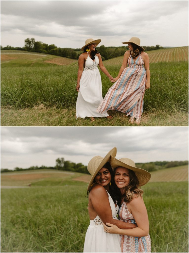 best friends photoshoot holding hands in sundresses in field at linganore winery with stormy sky