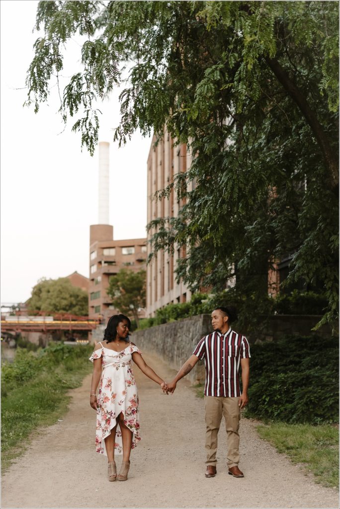 couple holds hands for dc engagement photographer on georgetown c & O