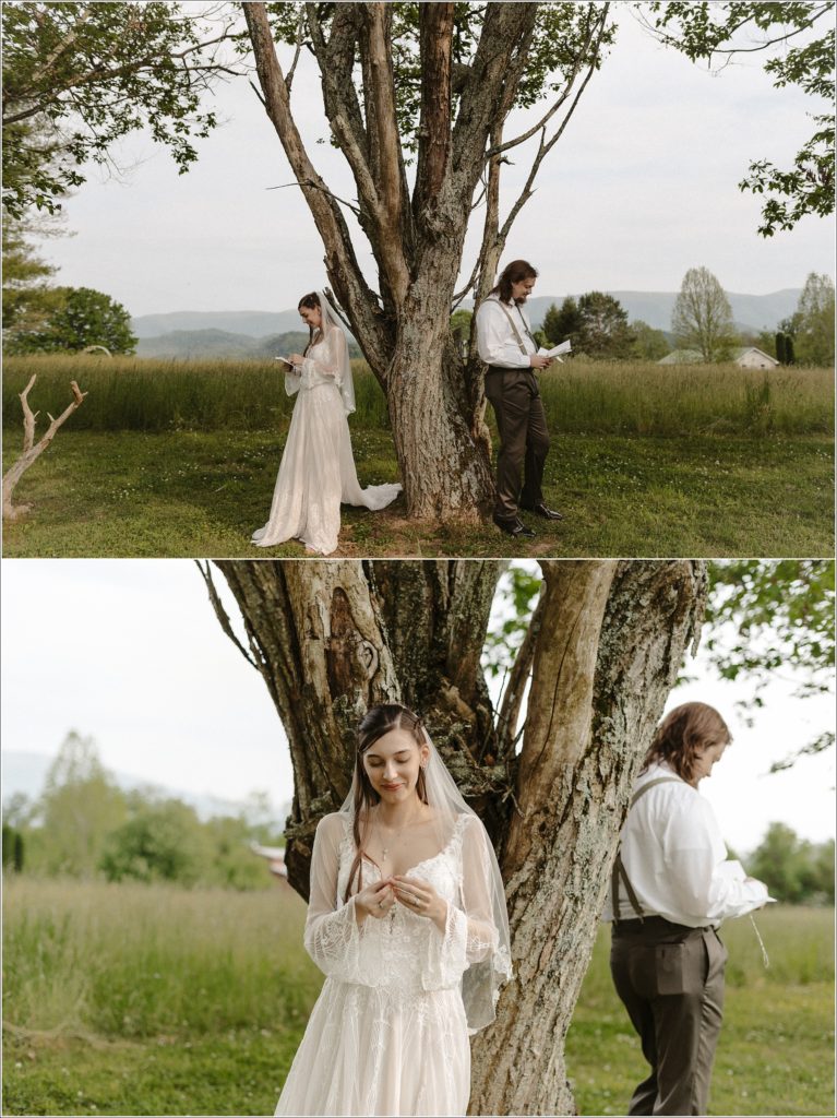 couple exchanges letters underneath a walnut tree in front of green fields in suit and bhldn lace dress in bristol tn wedding