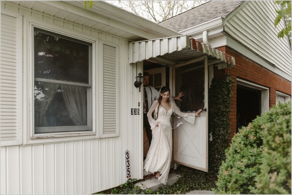 newly married couple leaves house in bhldn dress